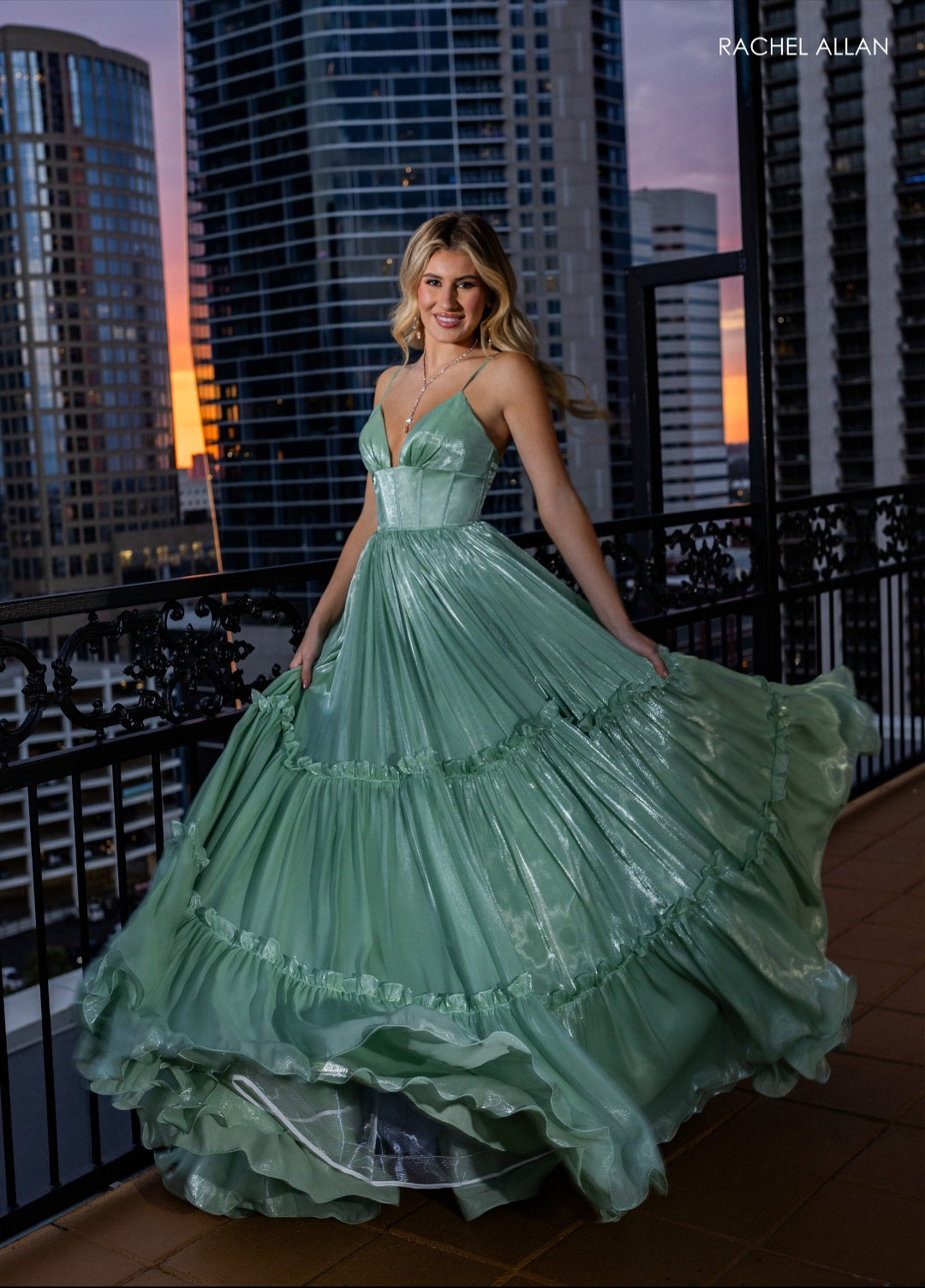 This shimmer tulle dress with its fun ruffle layered skirt is so elegant. Instock in sage size 20.