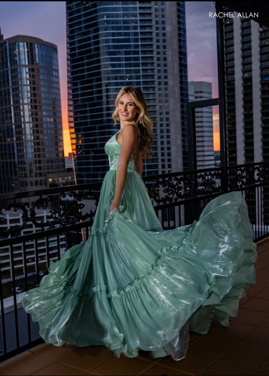 This shimmer tulle dress with its fun ruffle layered skirt is so elegant. Instock in sage size 20.